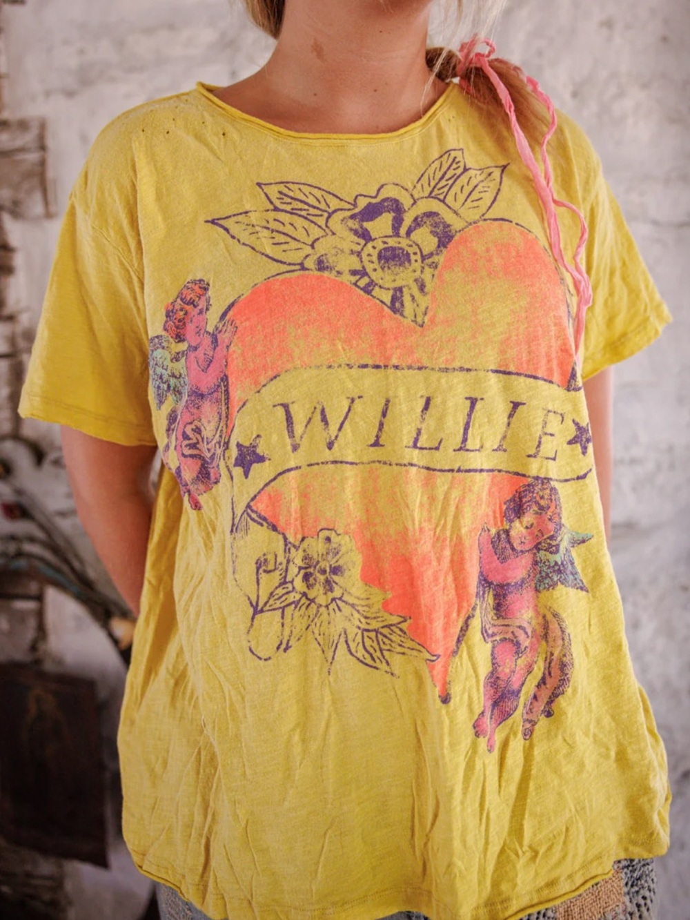 Magnolia Pearl Yellow Short-Sleeve Willie Nelson Tee with Pink Heart and Cherubs